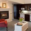 eagle-harbor-inn-2bdrm-fireplace-and-kitchen